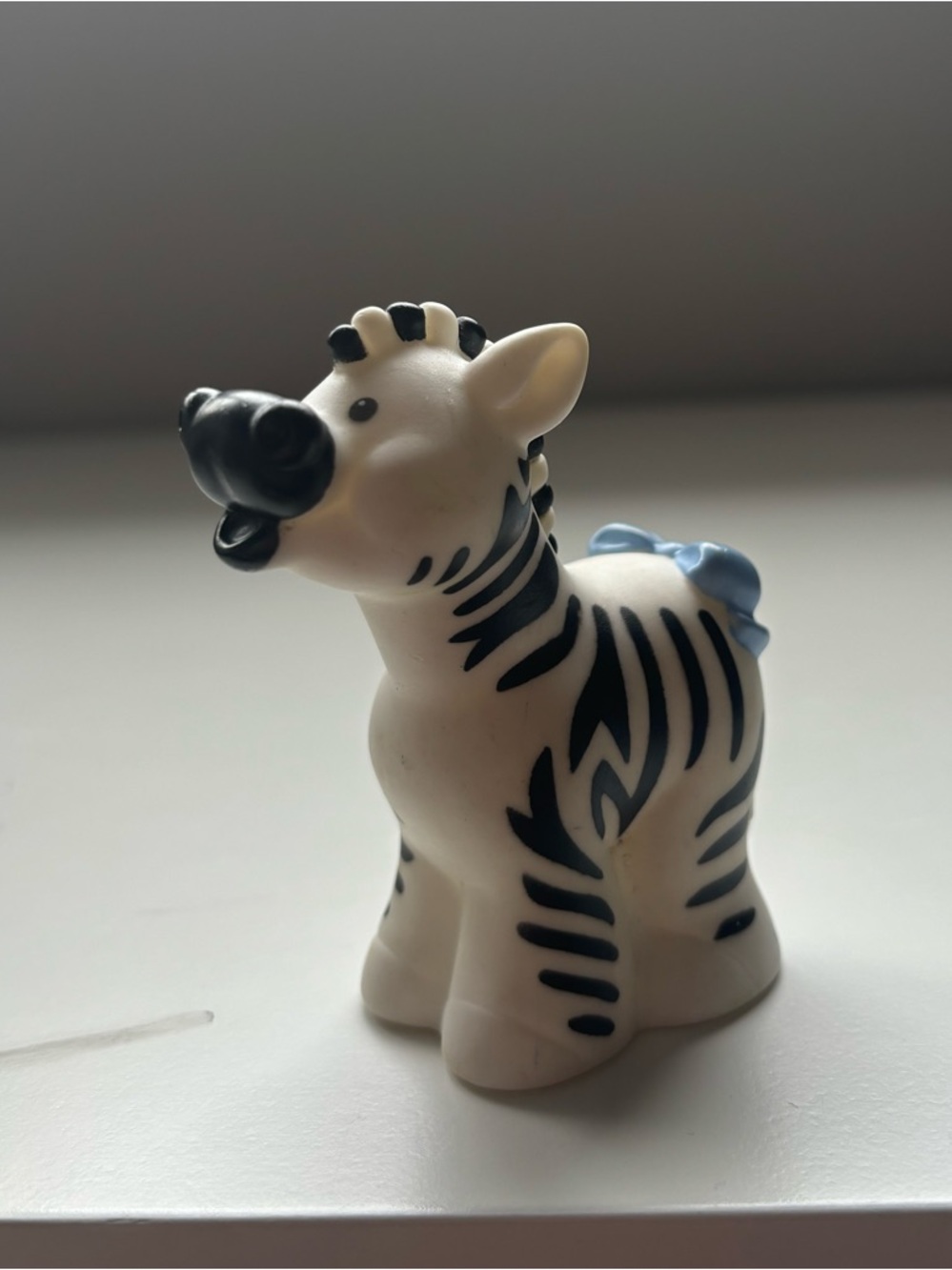 Little people zebra with a blue bow